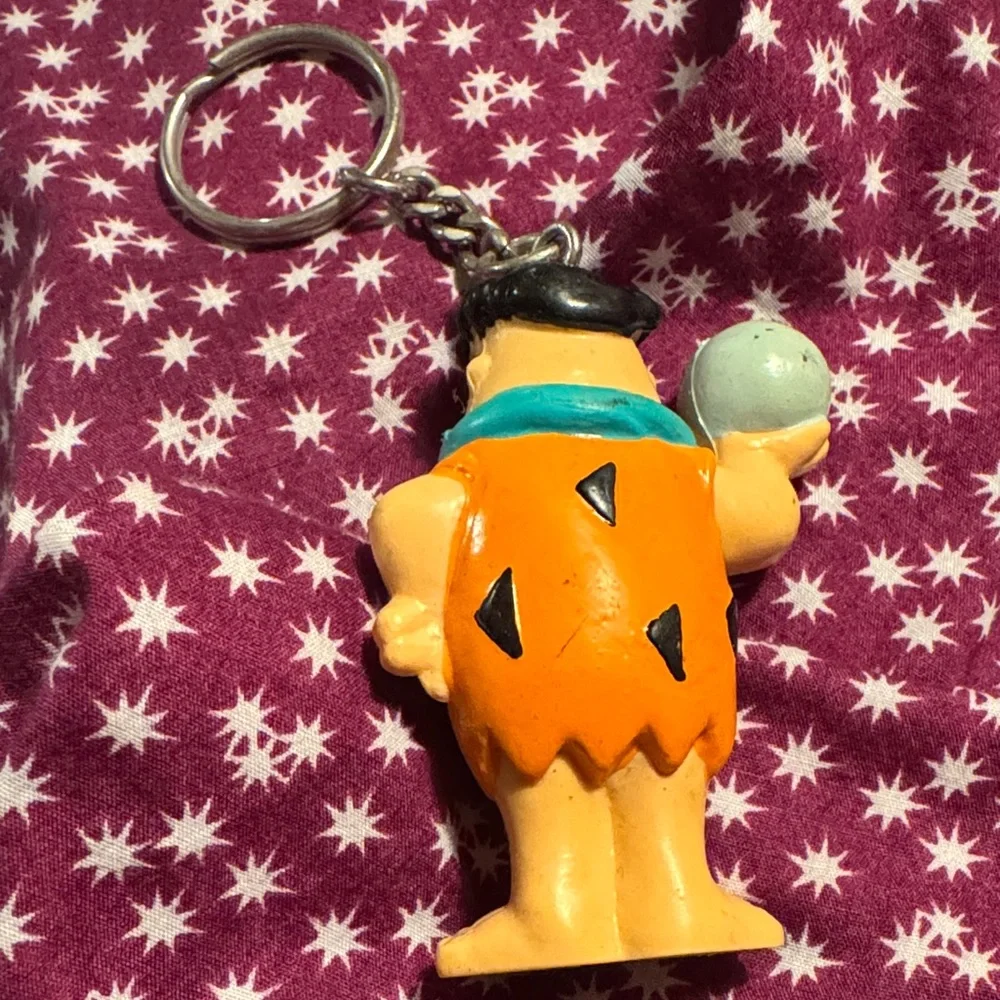 Fred Flintstone Cartoon Character Keychain with Orange and Blue Accents